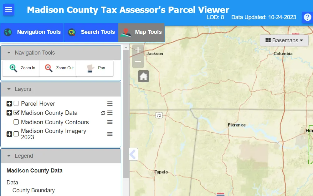 A screenshot of the Madison County Tax Assessor's Parcel Viewer displays a map with navigation tools, search tools, and map tools on the left side.